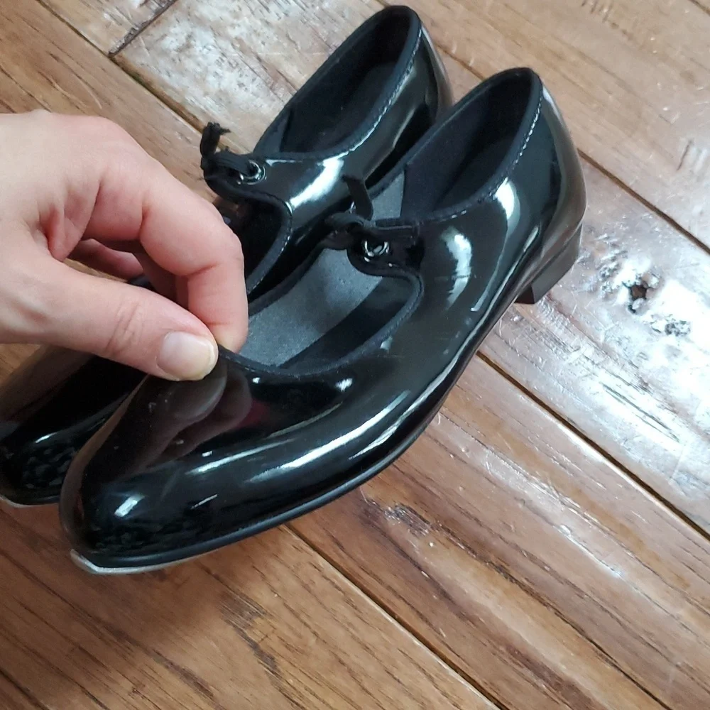 Black patent tap dance shoes